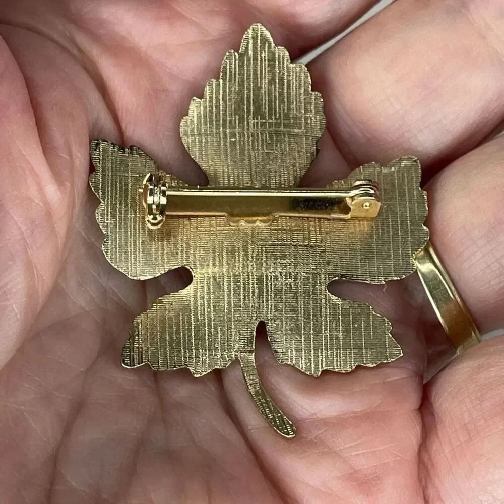 Vintage enamel maple leaf brooch.